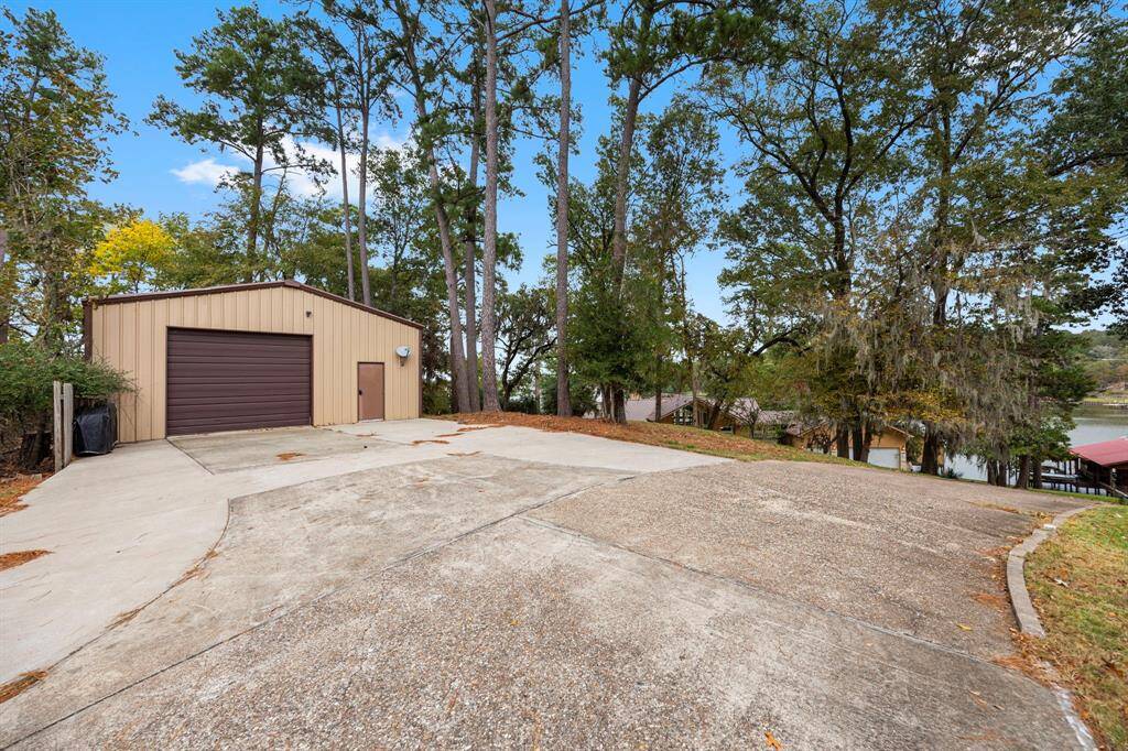 This property also features a 1,200 sqft detached workshop that includes living quarters and a full bath, offering versatile space ideal for hobbies, guests, or additional storage, making it a perfect complement to the main home.