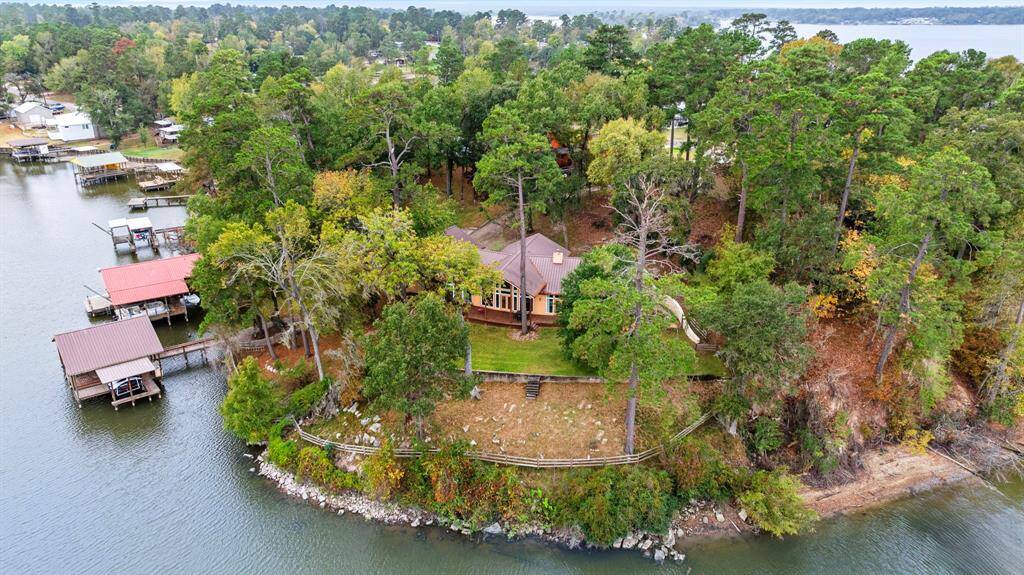 Outside, the yard blooms year-round with azaleas, gardenias, hydrangeas, fruit trees, and more, all kept lush by an automatic lake-water sprinkler system. The peaceful neighborhood is golf-cart-friendly, and nearby parks and pools offer relaxation and recreation.