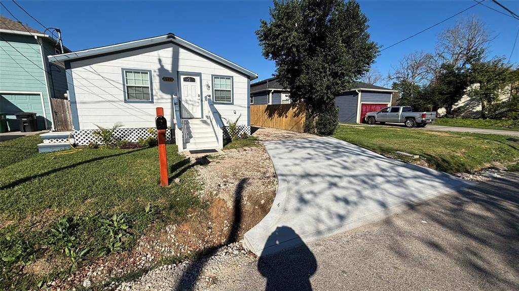 Other view of the new concrete driveway. The property is totally fenced for privacy.