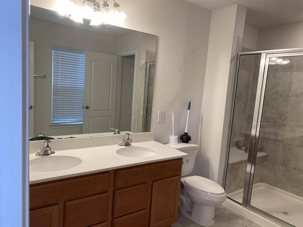 Master Bath with 2 sinks and separate shower.