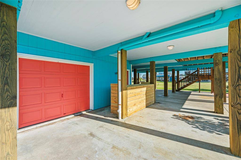 Single car garage with workshop and Half bath. Currently being used as Golf cart parking, storage and workshop.