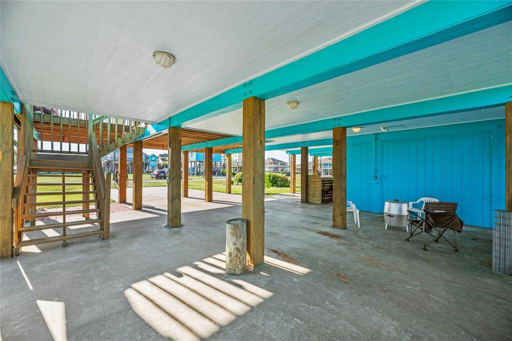 A lot of space under home for gatherings & parking including a new built-in Tiki bar.