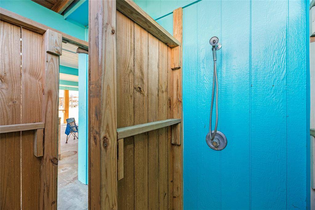 Additional shower located downstairs on ground level.