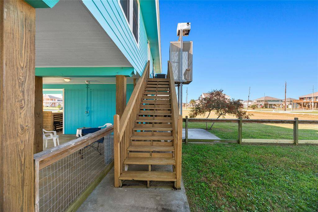 Stairs leading to back entry into utility room. Home also has a lift which was installed during the 2009 renovation.