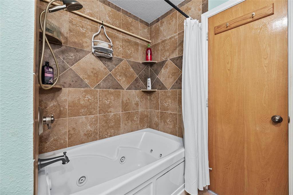 Secondary bath with jetted tub.