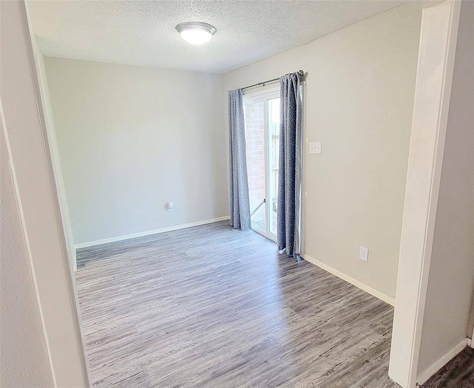 Dining area with Slider to fenced in patio.