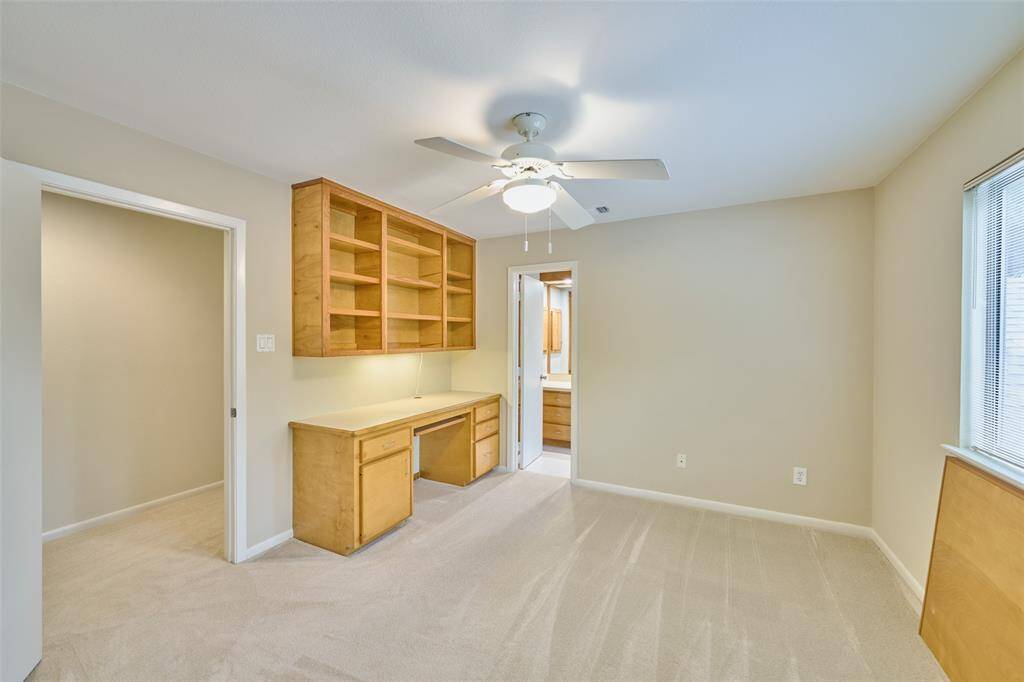 Secondary bedroom with built-in desk