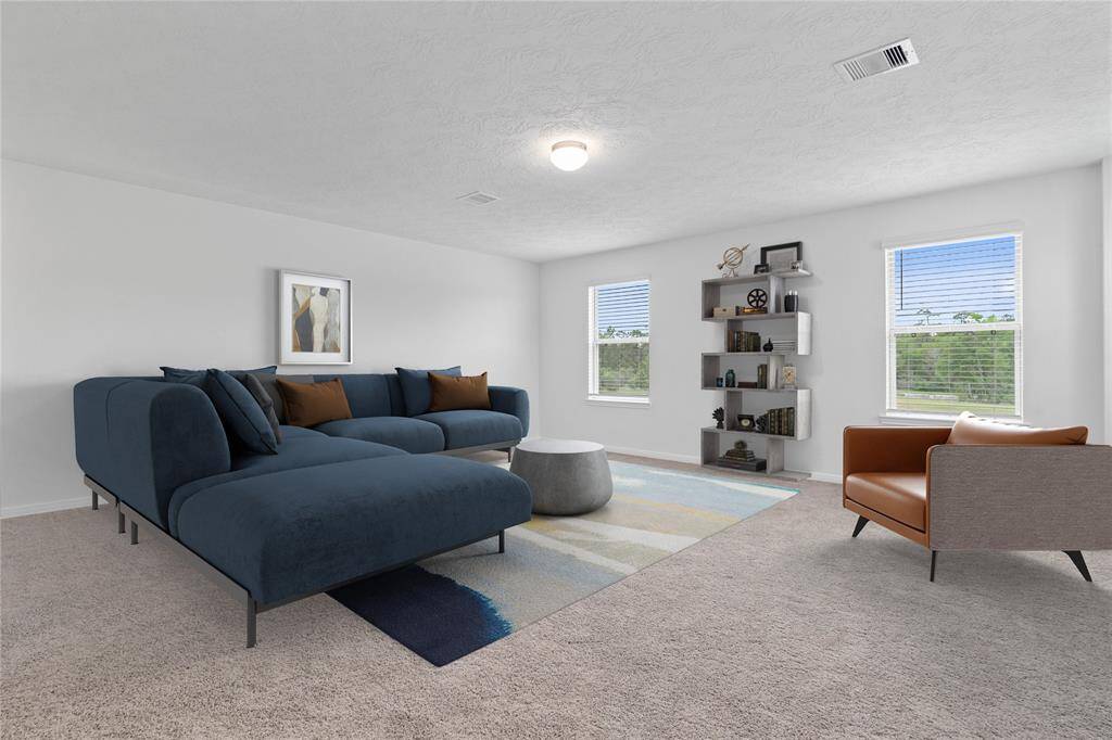 Come upstairs and enjoy a day of leisure in this fabulous game room! This is the perfect hangout spot or adult game room, this space features plush carpet, high ceiling, lighting, custom paint and large windows with privacy blinds.