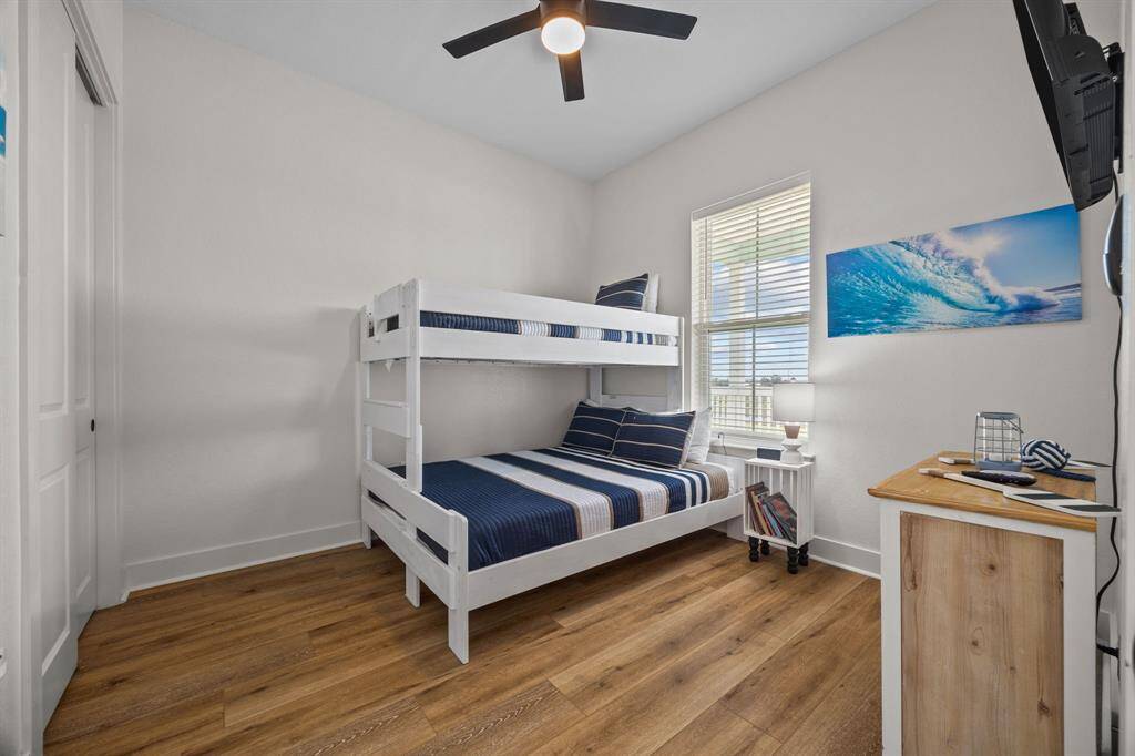 Second bedroom with wide plank laminate flooring and lots of room for even bunk beds if you desire.