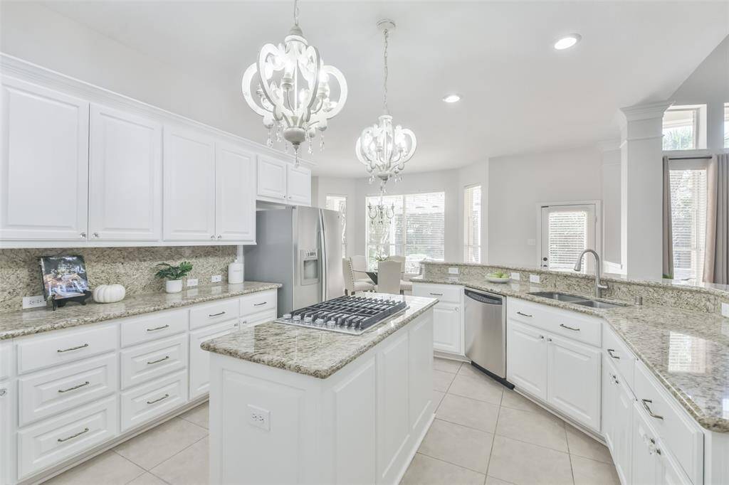 The family room flows nicely into the light & bright kitchen.