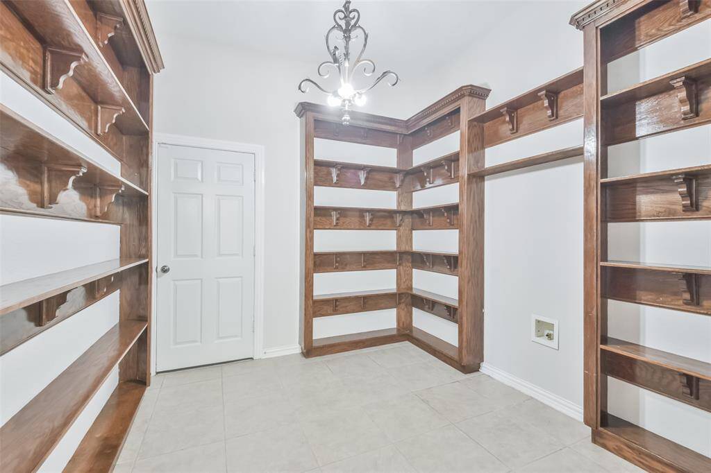 This room has so many possibilities including another pantry, wine room, collectibles space or put your own touches on it.