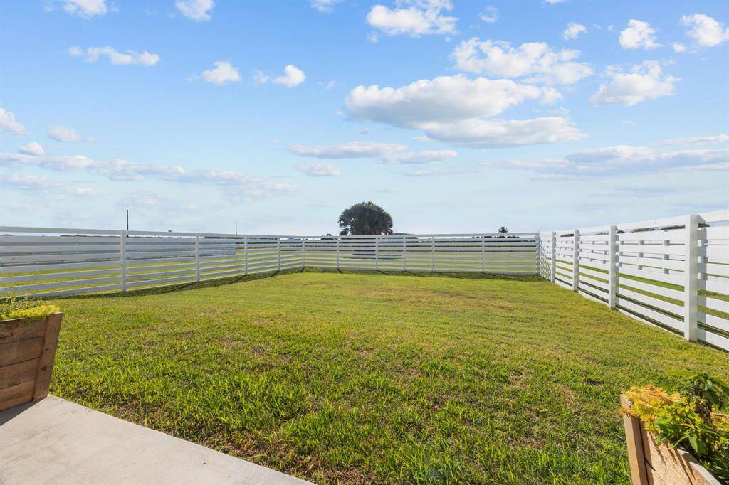 Large backyard that has plenty of space for the kiddos to run and play.