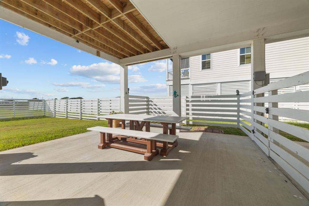 Outdoor covered patio space that would be perfect for all of your gatherings.