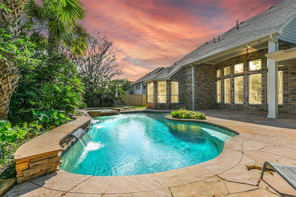 The pool has three cascading waterfalls and a spa waterfall spillover.