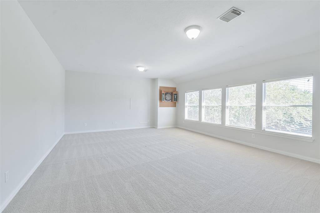 The game room upstairs is very large and light-filled.