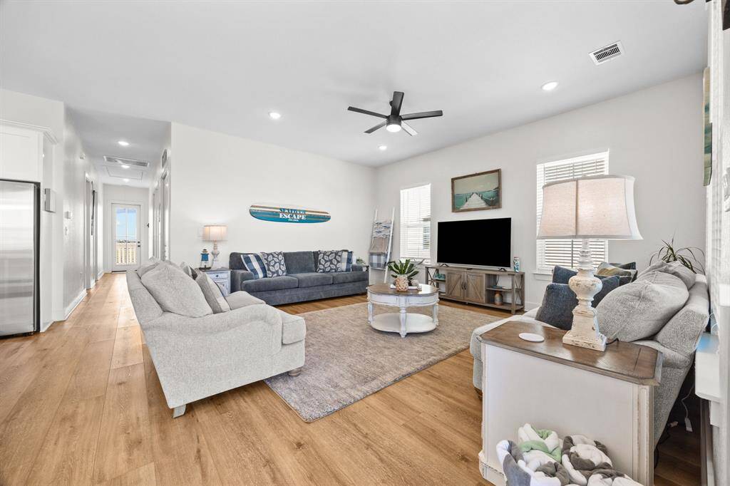Family room open to the kitchen space that is perfect for entertaining guests.