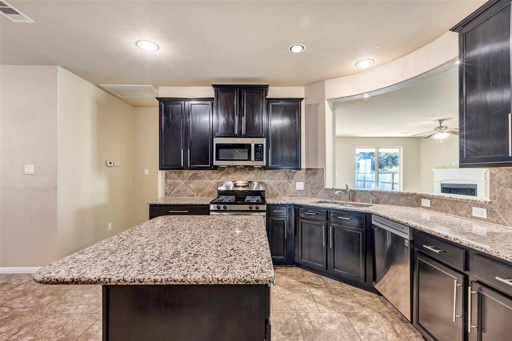 Great kitchen design. The island has a slight overhang to accommodate optional seating for those quick casual meals. Sweet prep area.