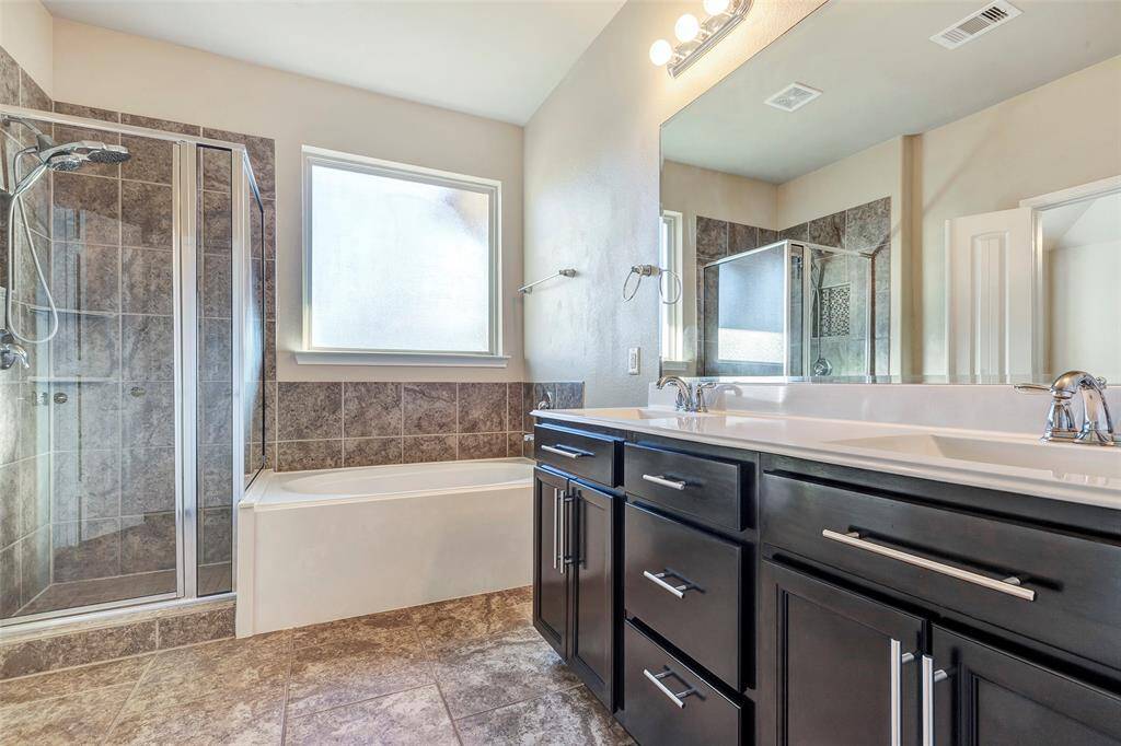 Dual sinks and refinished cabinets.