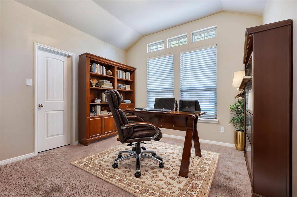 The downstairs secondary bedrooms have nice high ceilings and large closets. this secondary in the front features additional picture windows.