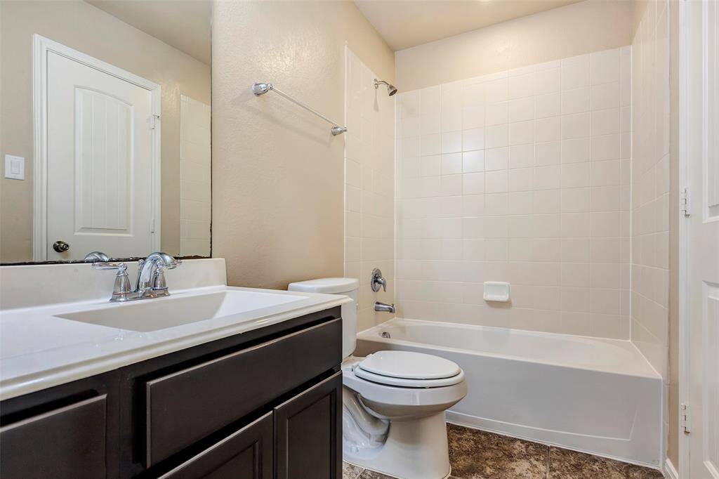 The en suite 3rd full bath is connected to the 2nd primary and the game room.