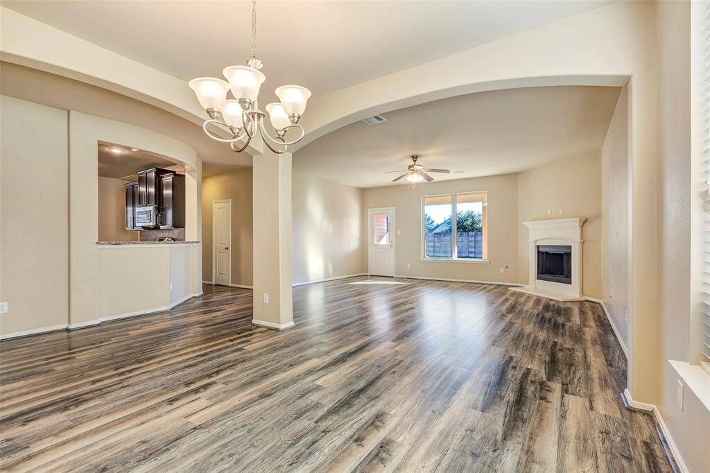 The main living area shines with large and open layout. Beautiful arches flow through the space.