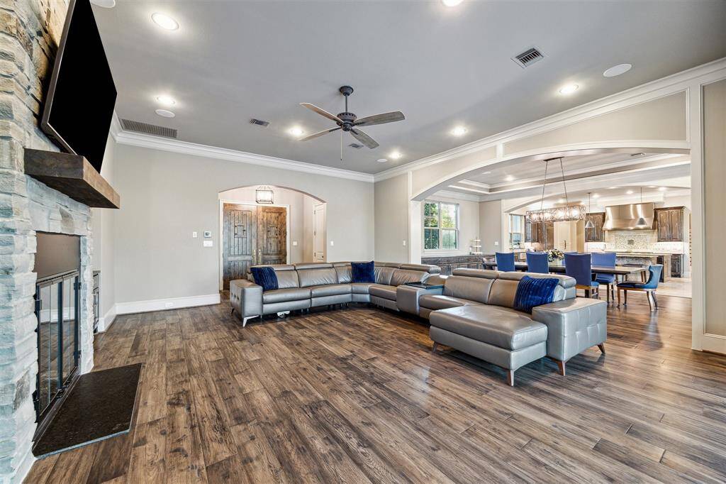 Step into the expansive family room of this exquisite home, where comfort and style converge to create a welcoming space for relaxation and entertainment.