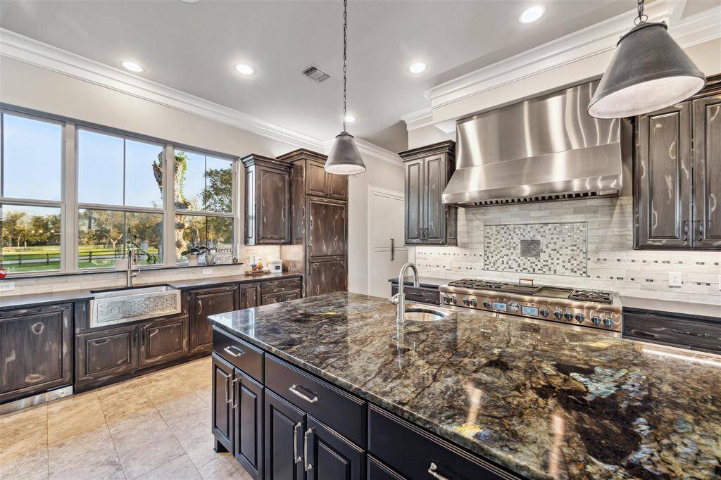 Every direction you turn within the kitchen you are enjoying the stunning property, mature trees, and an outdoor oasis that is unparalleled.