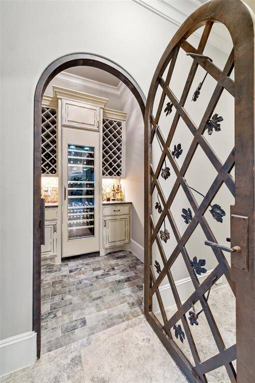 Wine connoisseurs will appreciate the dedicated wine room, ideal for storing and showcasing your collection in style.