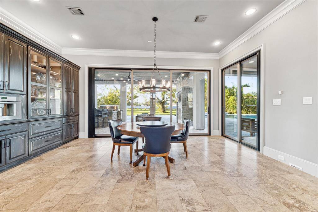The breakfast room offers double sliding doors that creates the perfect indoor/outdoor blend.