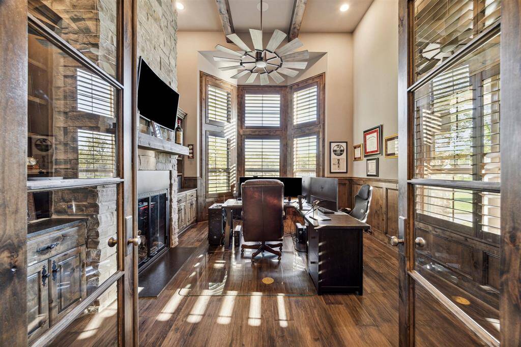 The dedicated study offers built in shelving as well as completed with a fireplace, high ceilings, beans and rich finishings throughout.