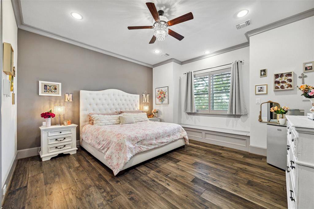 This stunning home features spacious bedrooms, each with its own private dedicated bathroom and custom walk-in closets. This secondary bedroom offers a 'secret room' that has endless opportunity.