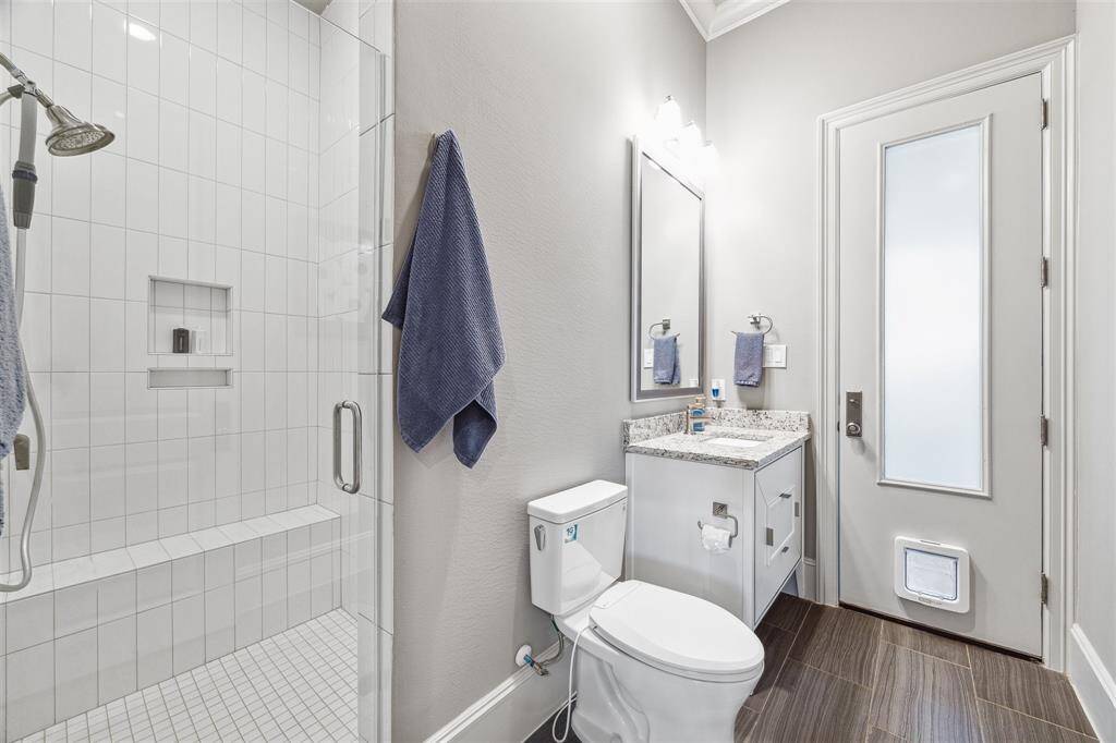 This full bath is accessible from the outdoor oasis.