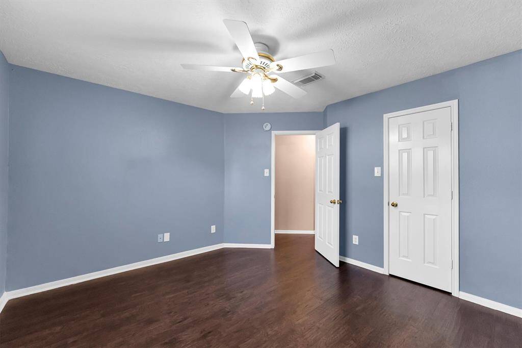 Secondary bedroom with walk in closet