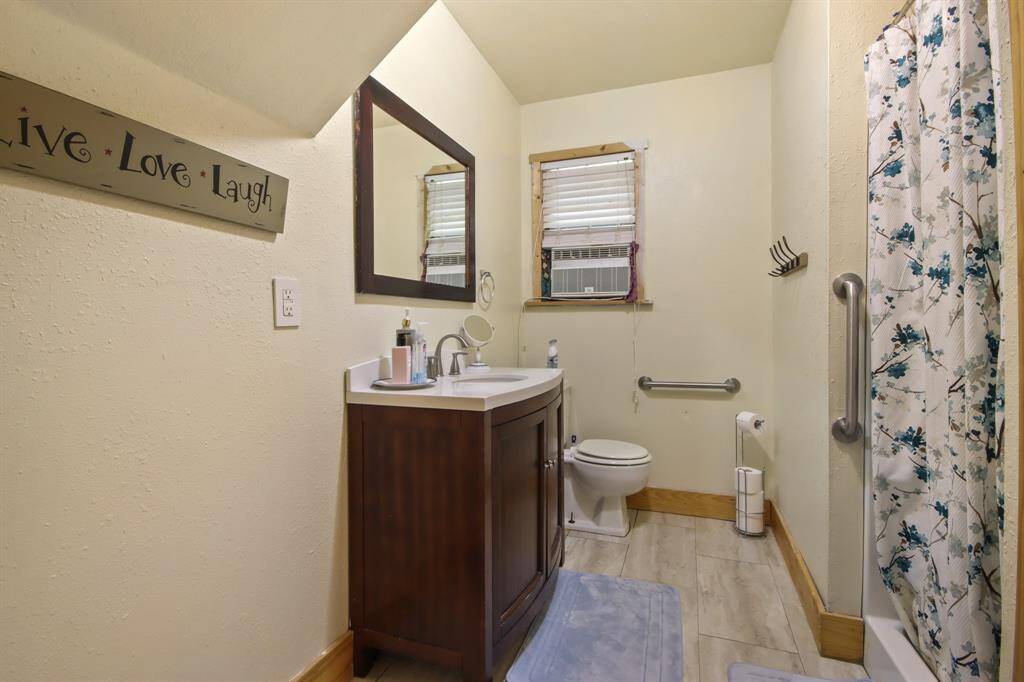 Full bathroom downstairs with a shower.