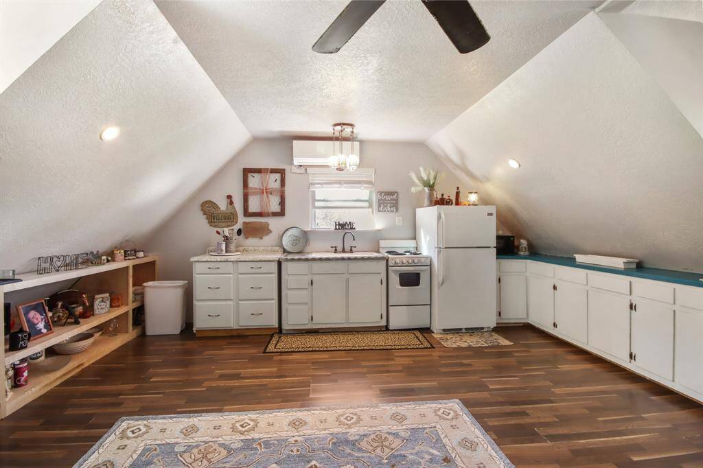 Kitchen is upstairs in an open concept layout.