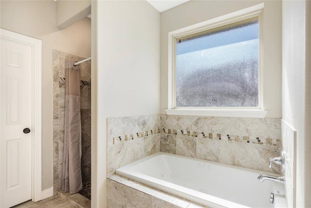 Primary bath with a jetted tub and separate shower