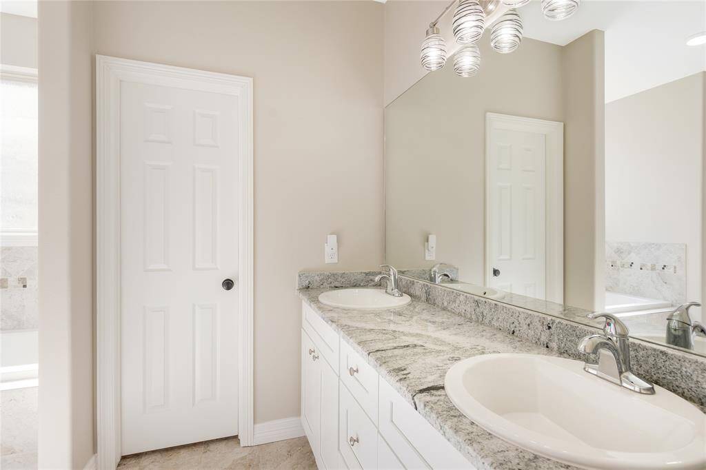 Primary bath with a oversized vanity and double sinks.