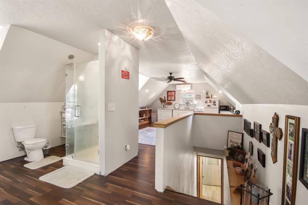 View to show the open concept loft space upstairs.