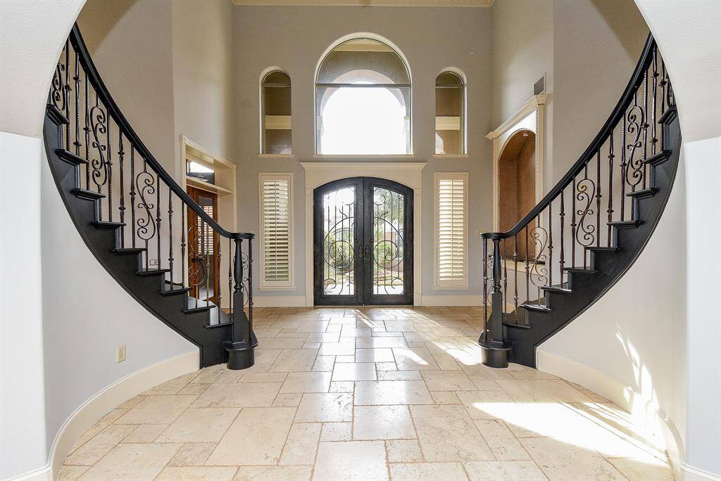 From the moment you enter, you know you are truly home. The double winding staircase makes a statement as you enter!