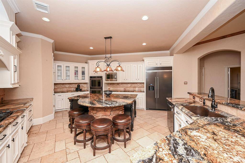 On top of the gorgeous setting, you can look out at the gorgeously landscaped back yard and lake view!