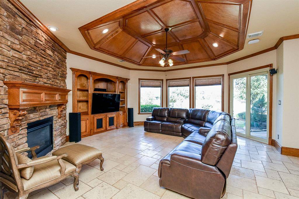 The Family Room is warm ad inviting with wood accents, and a gorgeous stone fireplace.
