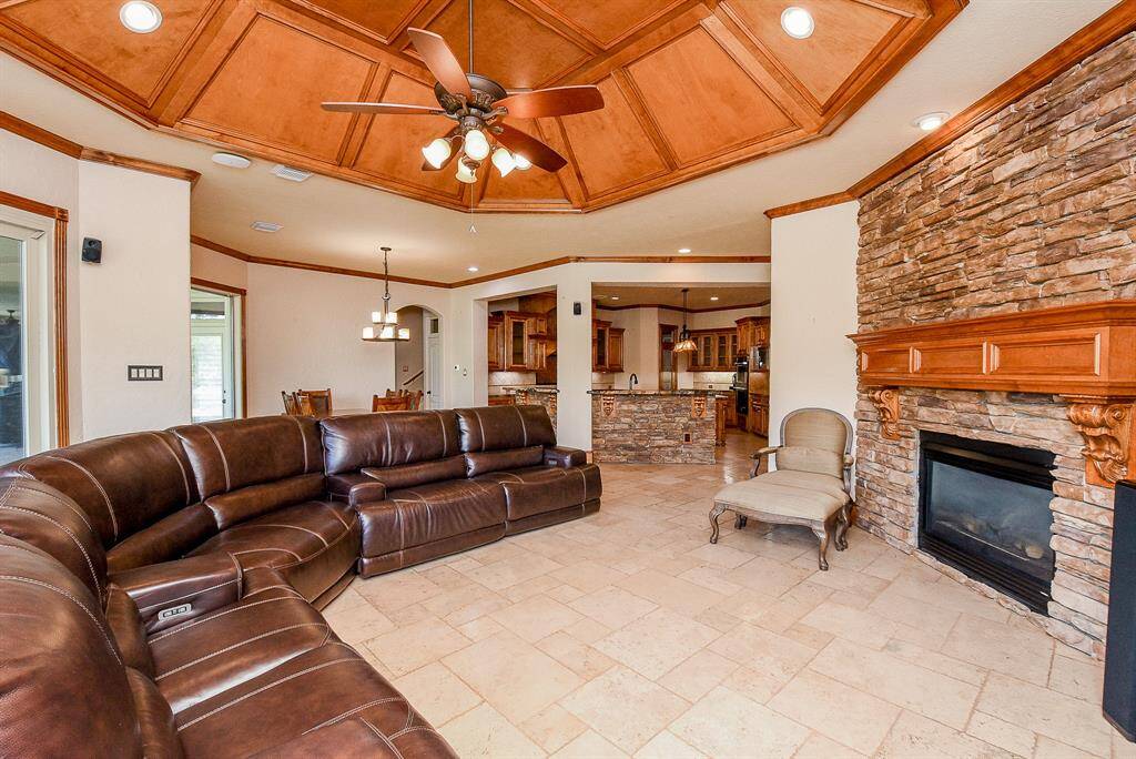 The ceiling also has a vaulted look with wood accents.
