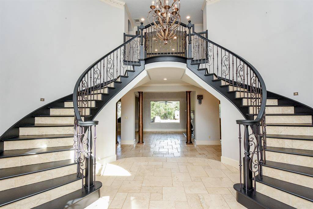 Welcome home to this stunning 6,091 sq ft home in a gated community - lakefront!
