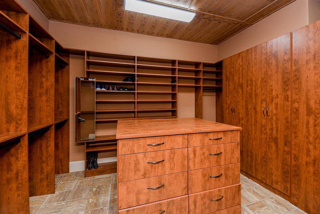 The Primary Bedroom Closet is custom built and also features a cedar ceiling!