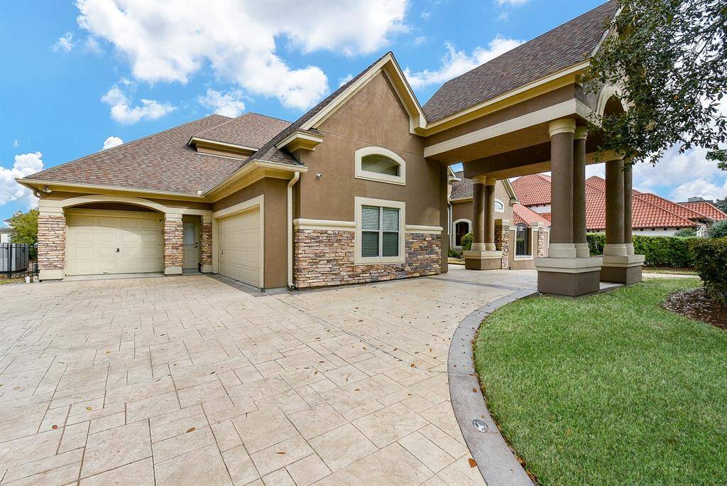 The exterior of this home is stunning as well with stucco & stone finishes. There is a large porte cochere in the front and a 3 car large garage with extra space! Double wide area so easy to back in and out of too.