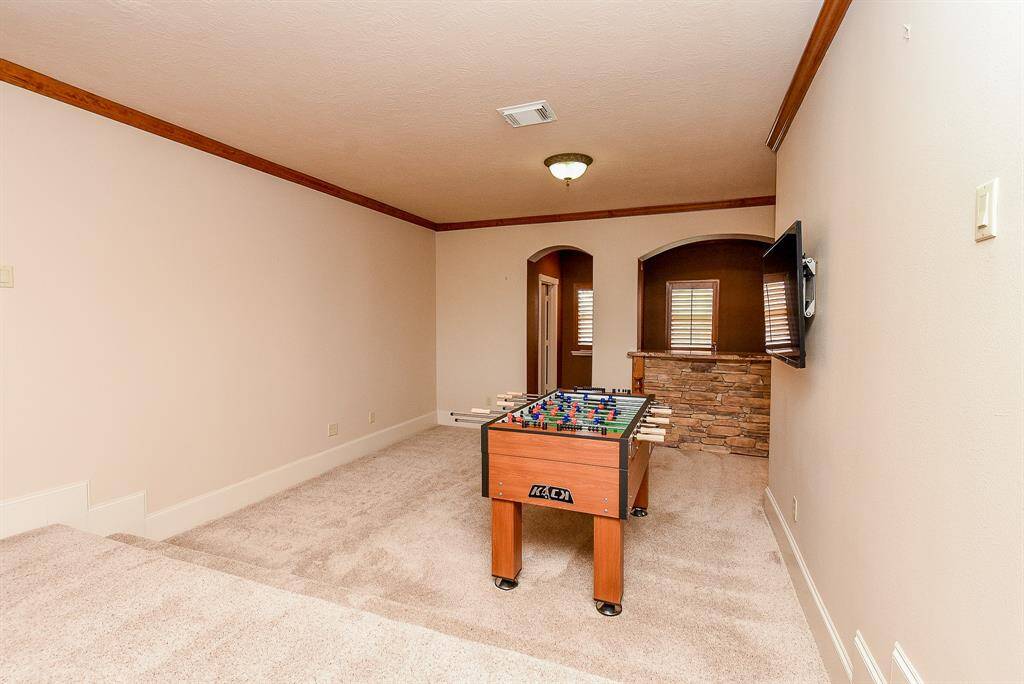This shows the second part of the Game Room and Bar area - there is also another 1/2 bath upstairs so guests don't have to access anyone's private bathroom.