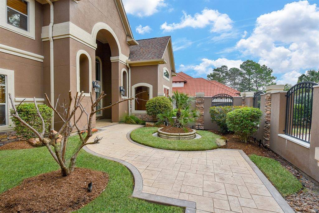 Another view of the front shows a courtyard area near the front doors.