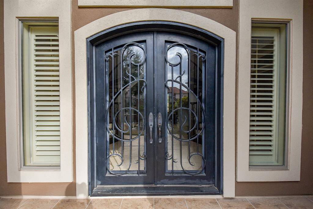 The iron double doors are another statement as you enter!