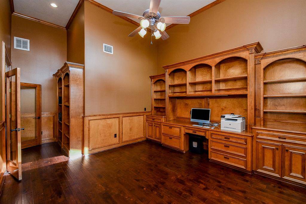The Study is to the right as you enter and is very large with high ceilings and built ins.  The wood floors give it a very warm/rich feeling.