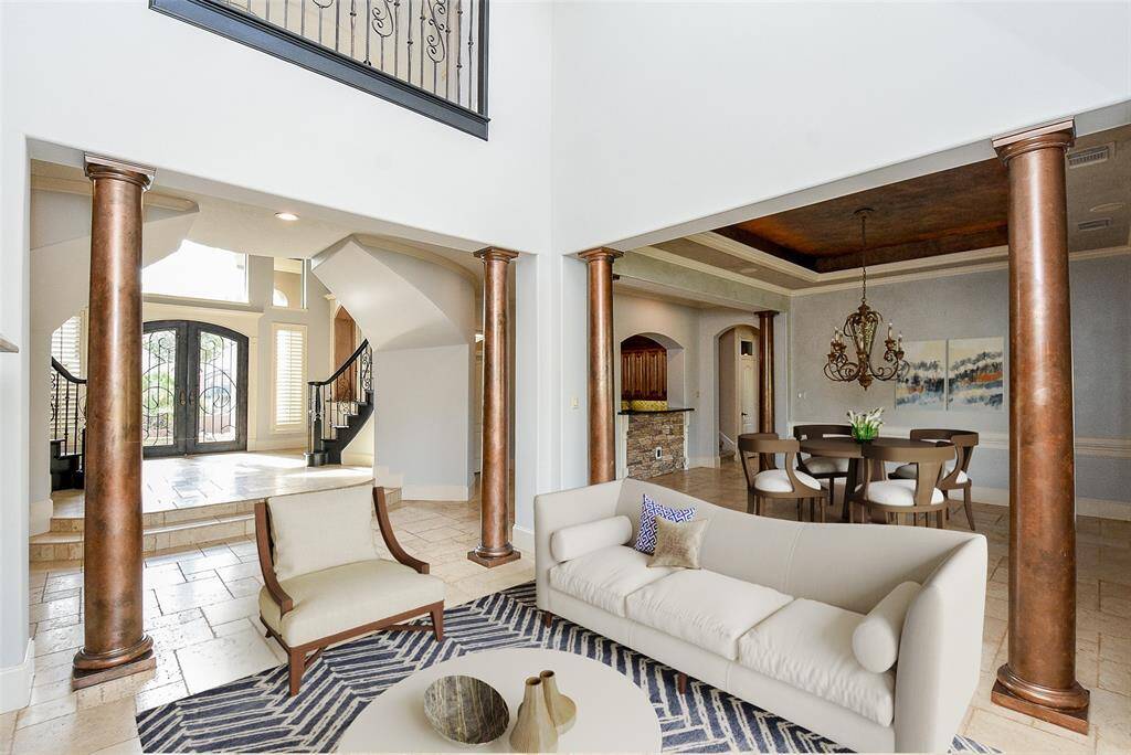 The Formal Living Room & Dining areas are very open and make for great entertaining - there is also a wine cellar and bar area too - perfect for parties or just relaxing after a long day at work.  This photo is virtually staged.